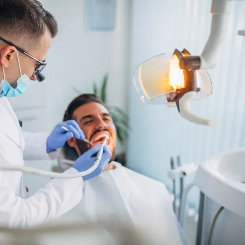 Dentist performing a routine dental checkup in Islamabad