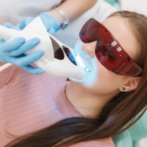 In-clinic teeth whitening procedure using professional whitening light